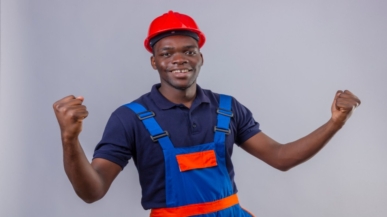 young-african-american-builder-man-wearing-construction-uniform-safety-helmet-clenching-fists-smiling-standing-with-happy-face-celebrating-victory-winner (1)